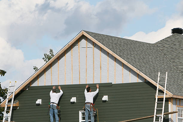 Professional Siding Installation technician working in Lansing, OH